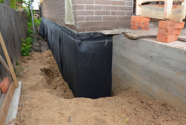 Happy homeowners after waterproofing job in Mitchell